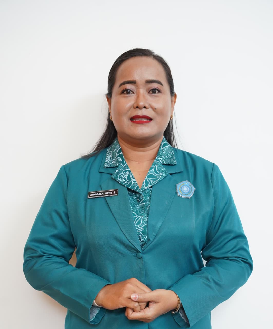 Ny. Anggala Merry, S.T. Keb